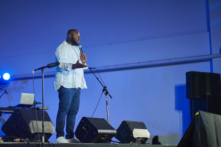 A Man Talking On The Stage 