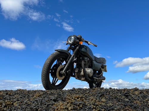 Free stock photo of blue sky, classic motorbike, clouds Stock Photo