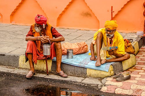 Elderly Men Sitting on the Street