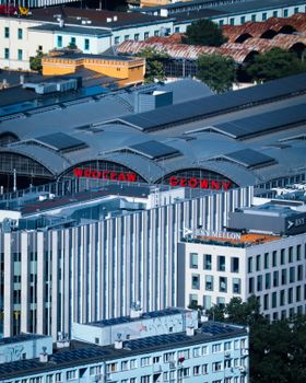 A vibrant aerial view of Wrocław Główny train station amidst the urban cityscape.