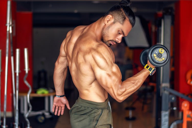 A Man Lifting A Dumbbell