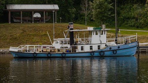 Blue Tugboat on Dock
