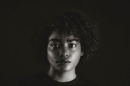 Black and White Photo of Woman with Afro Hair
