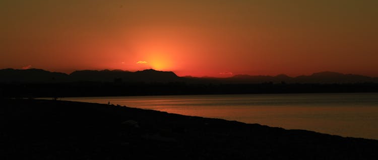 Silhouette Of Mountain During Sunset