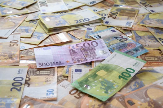 A collection of Euro banknotes representing wealth, savings, and European economy.