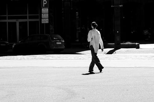 Woman Walking on City Street