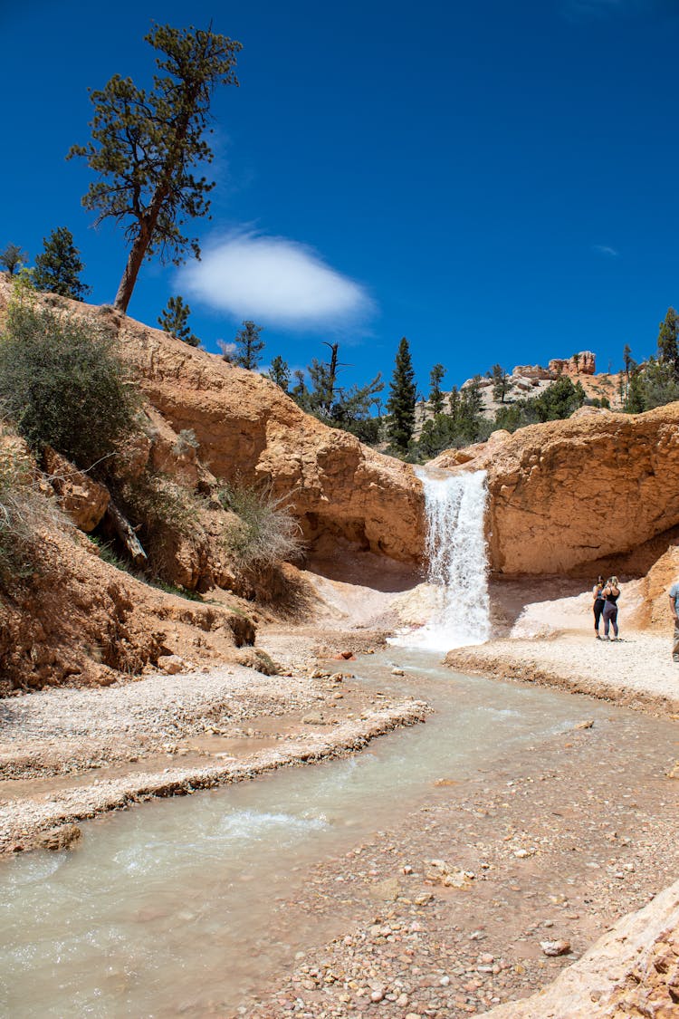 A Waterfall At The Mossy Cave In Utah