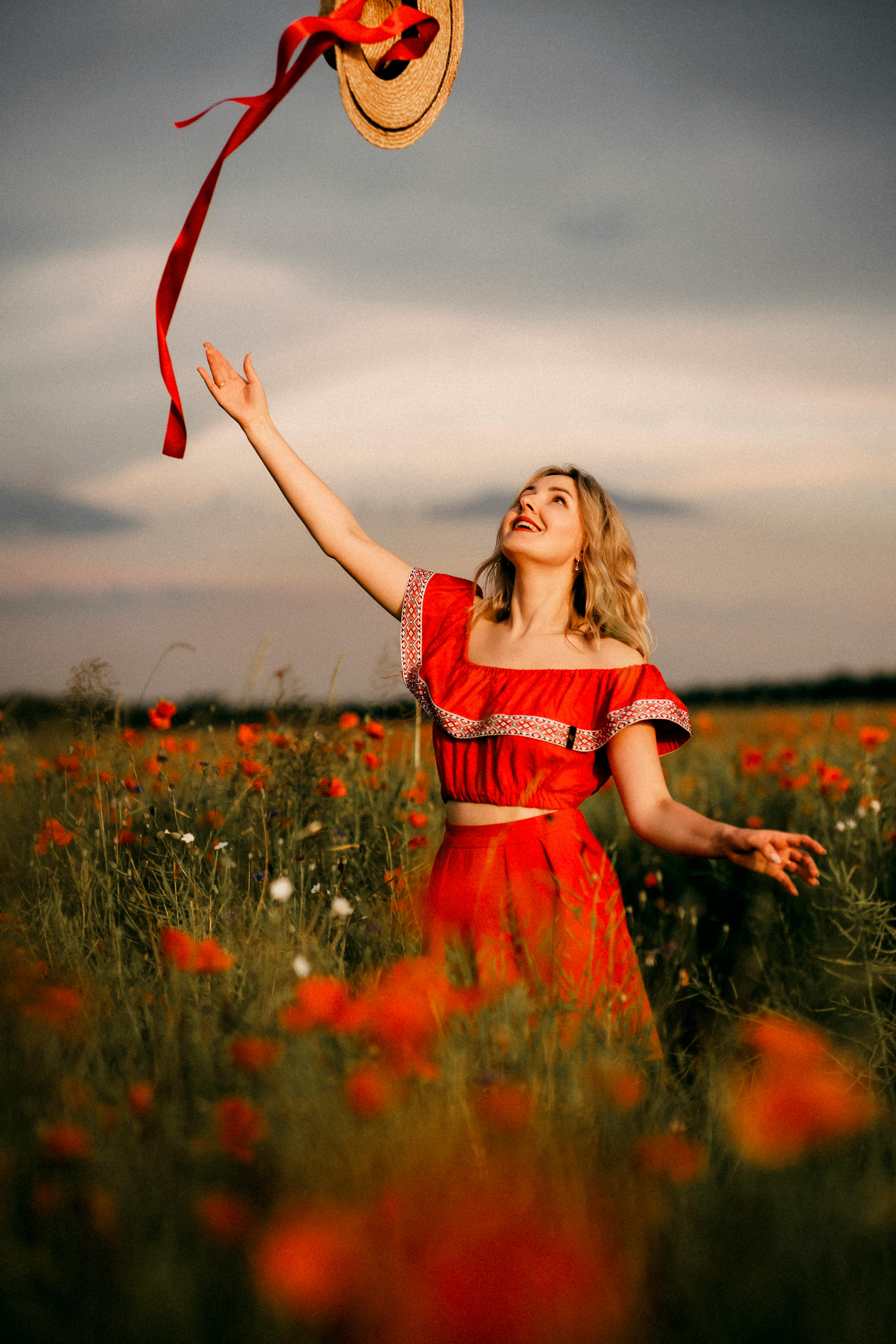 Woman Throwing Hat on Meadow · Free Stock Photo