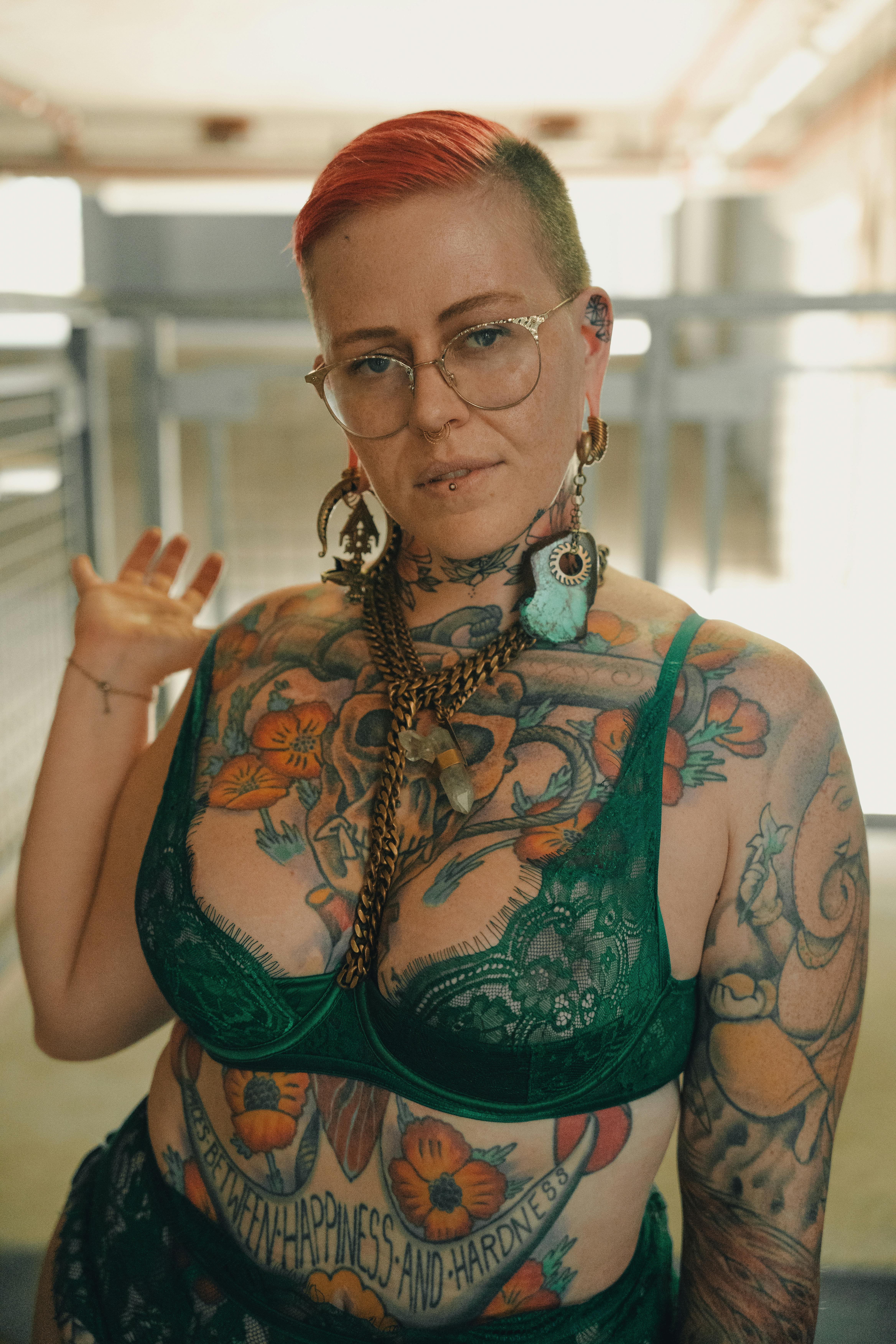 Premium Photo | A woman with tattoos on her body is wearing a tattoo.