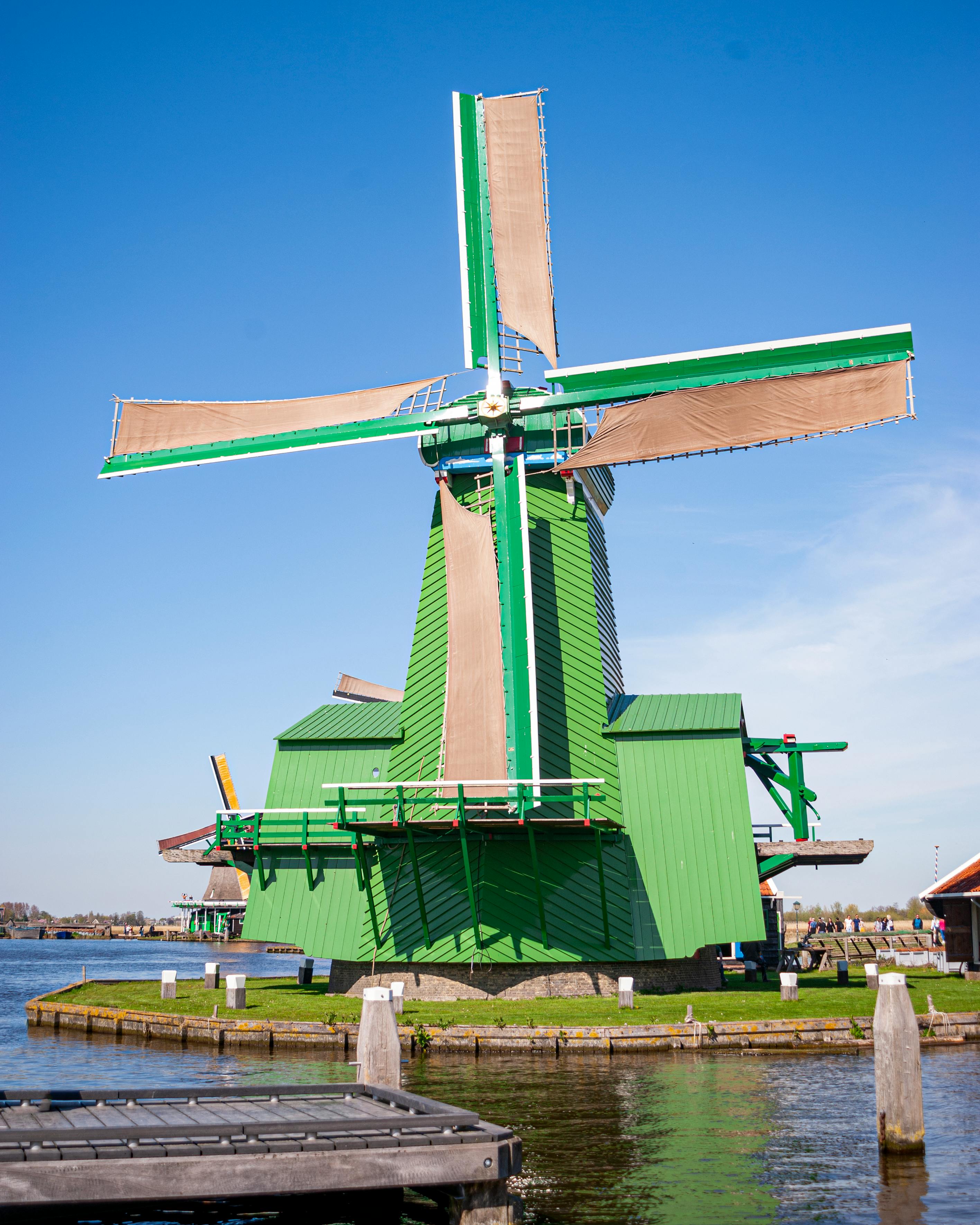 Green and Brown Windmill Beside the Lake · Free Stock Photo