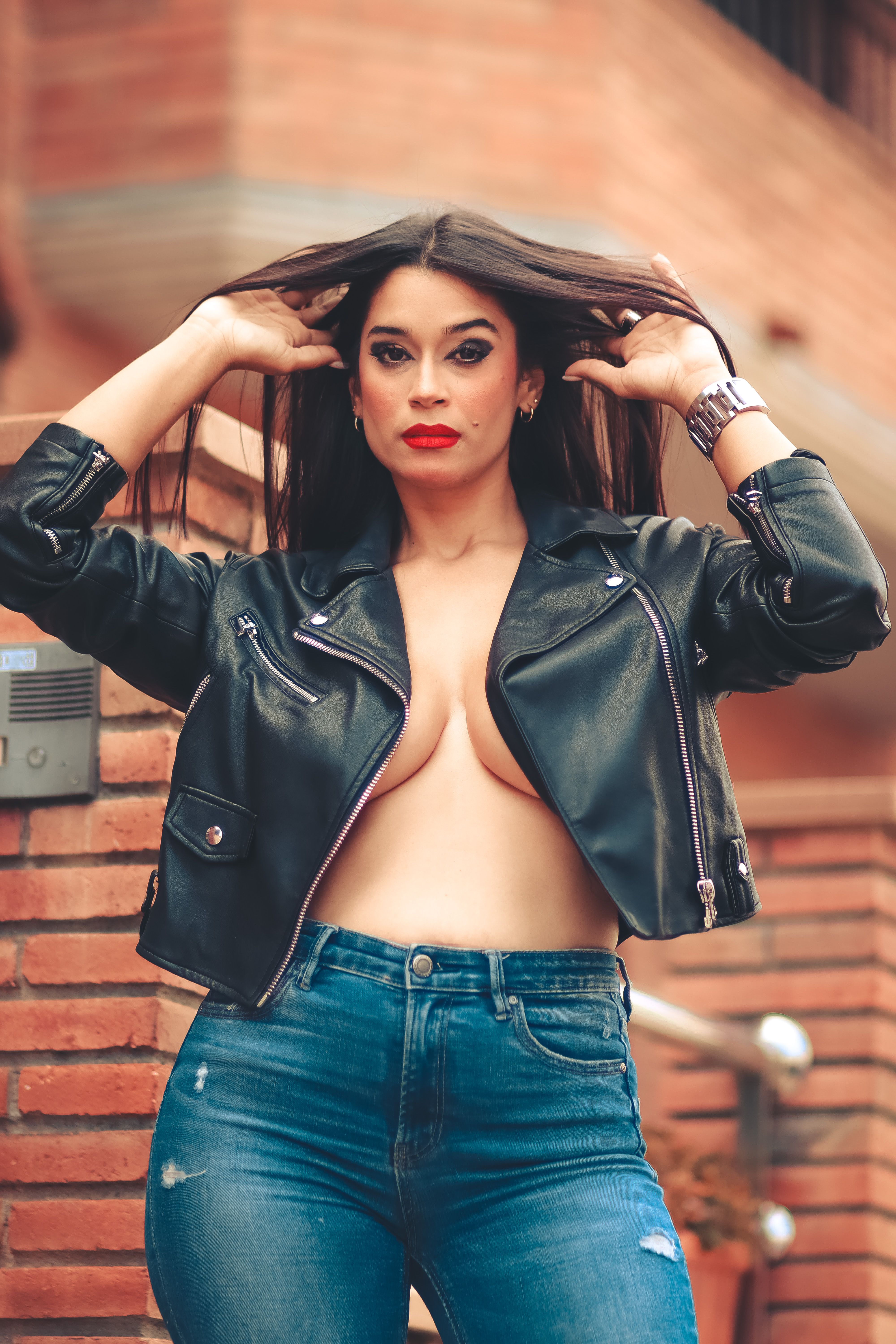 A Woman in Black Leather Jacket and Blue Denim Jeans · Free Stock Photo