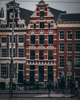 Explore Amsterdam streets with iconic architecture and lively urban atmosphere.
