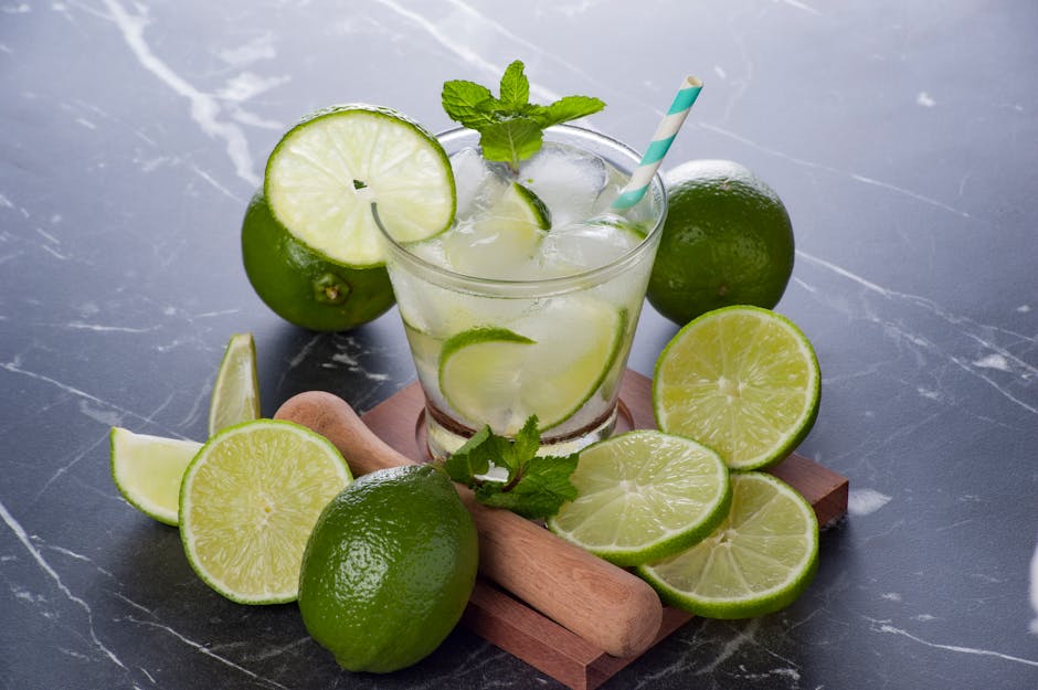 A chilled caipirinha with fresh limes and ice, perfect summer cocktail.