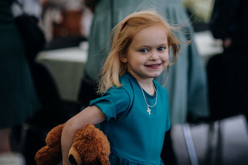 Girl Holding a Teddy Bear