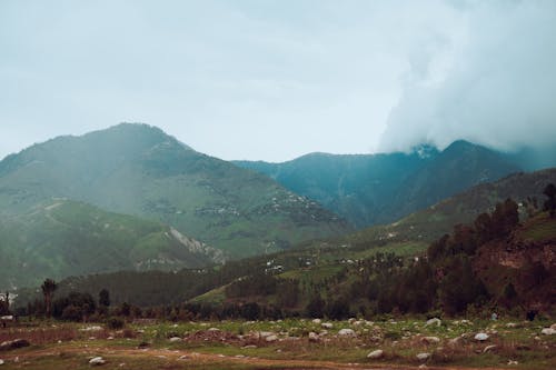 Green Mountains Under Cloudy Sky