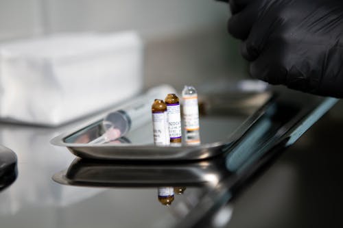 Pieces of Opened Vials on Stainless Tray