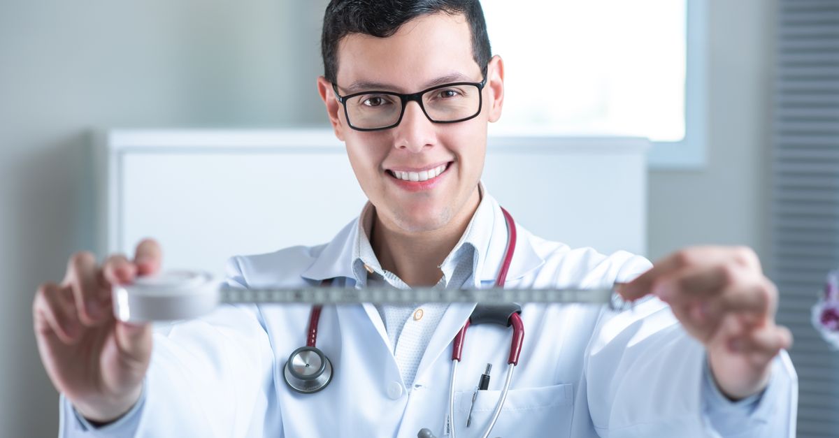 Doctor Using Measuring Tools A Doctor Holding a Measuring Tape · Free Stock Photo