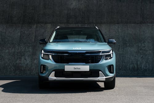 Blue Car Parked on Concrete Road