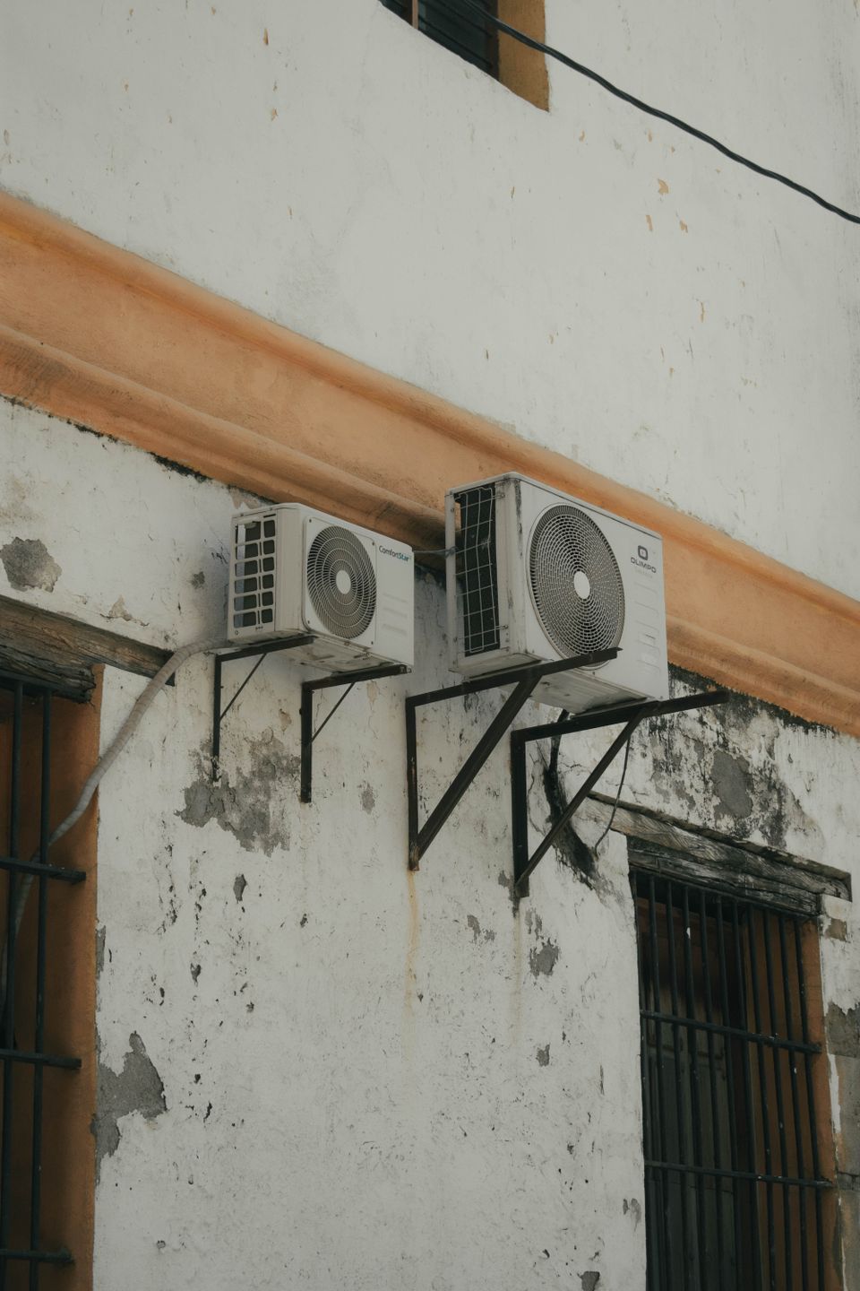 Old outdoor units on a weathered wall