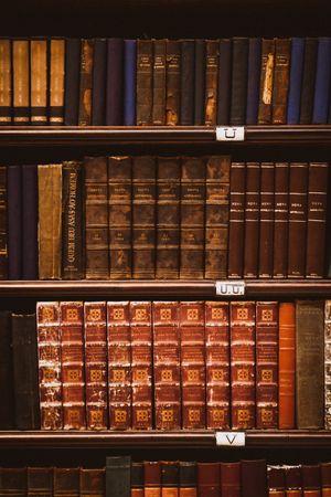 Stacked library books, photo by Jonathan Borba on Pexels