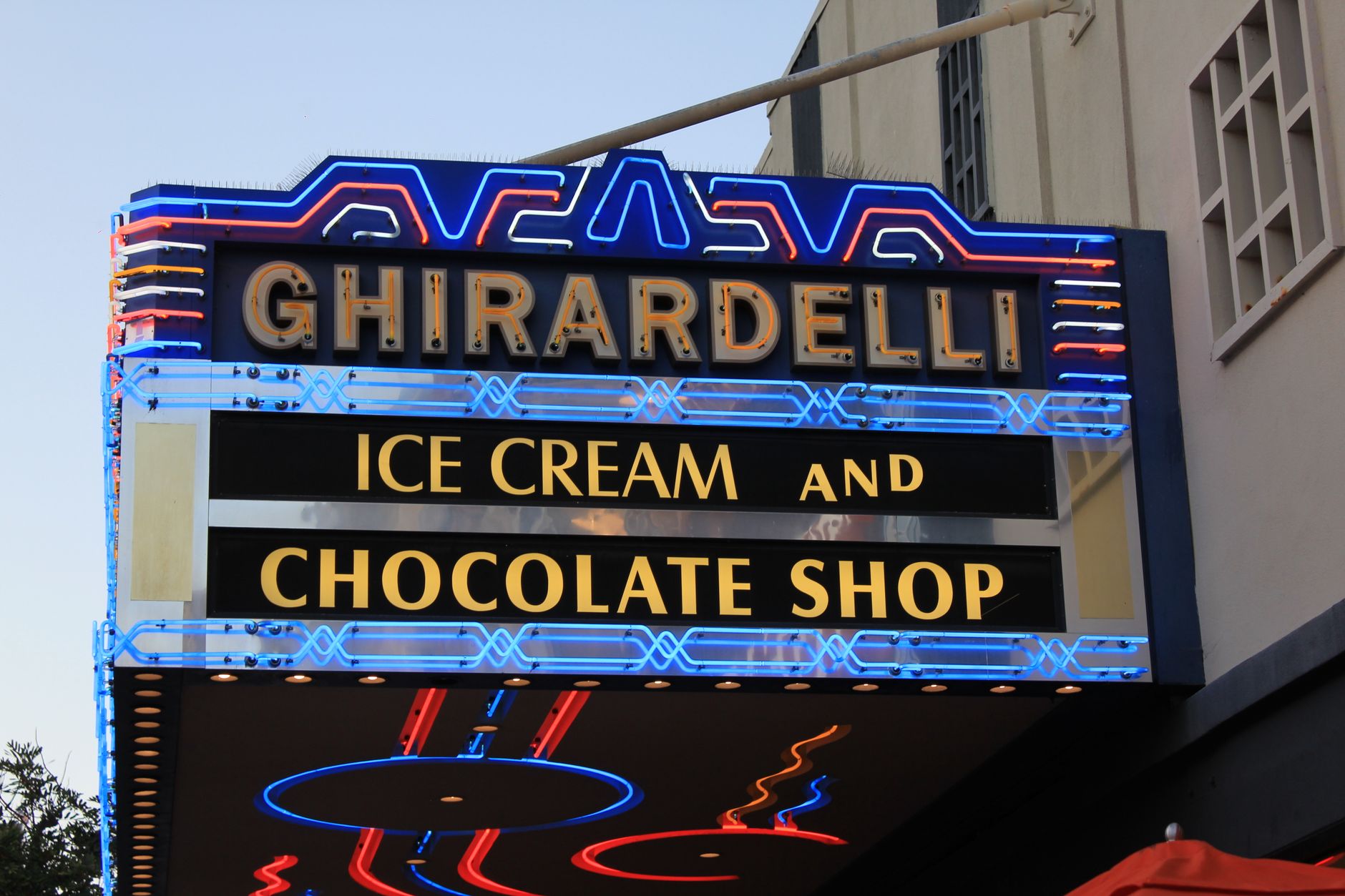 Waffle cone holding a scoop of creamy vanilla ice cream with sprinkles