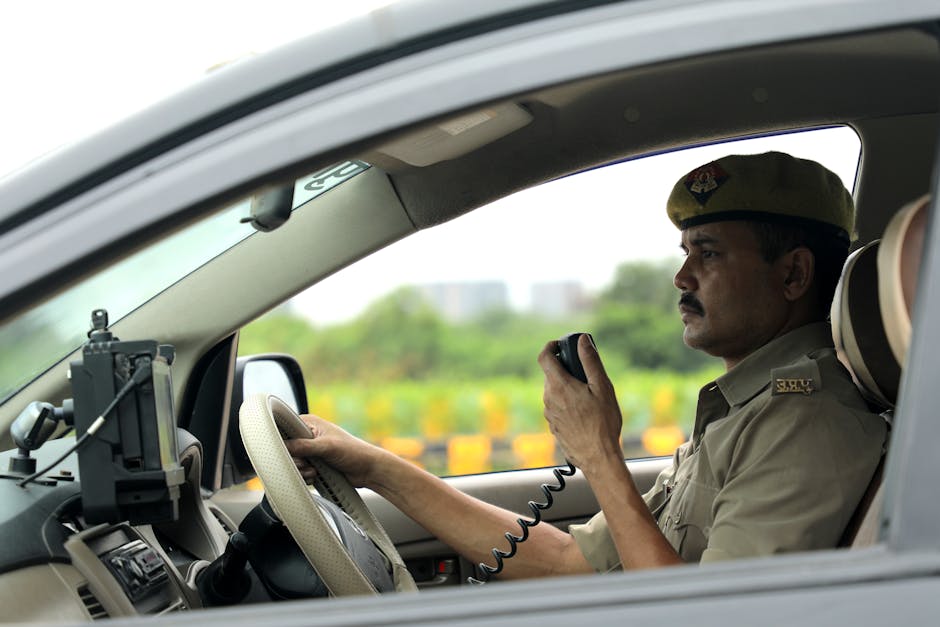 A small operations team reviewing a safety inspection alert on a laptop screen with a highlighted CTA variant shown in a dashboard. Lens: 112 Uttar Pradesh