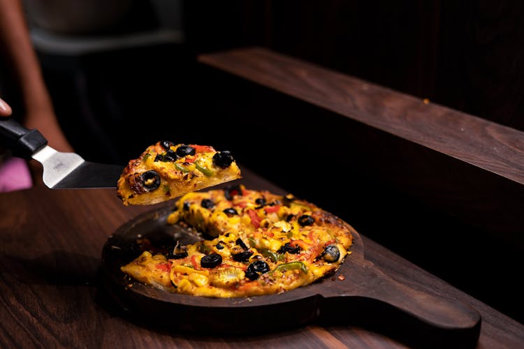 Pizza On Brown Wooden Tray