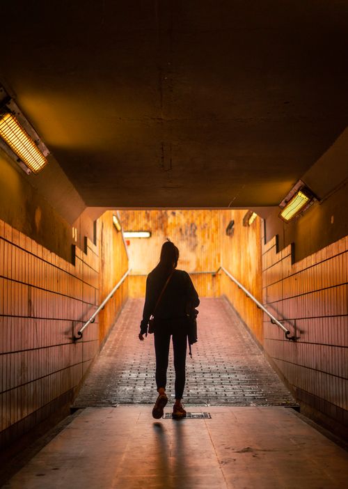 Free Silhouette of a woman walking in an underpass in Liège, Belgium. Stock Photo
