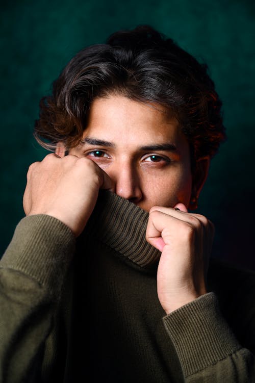 Man in Green Sweater in Close Up Photography