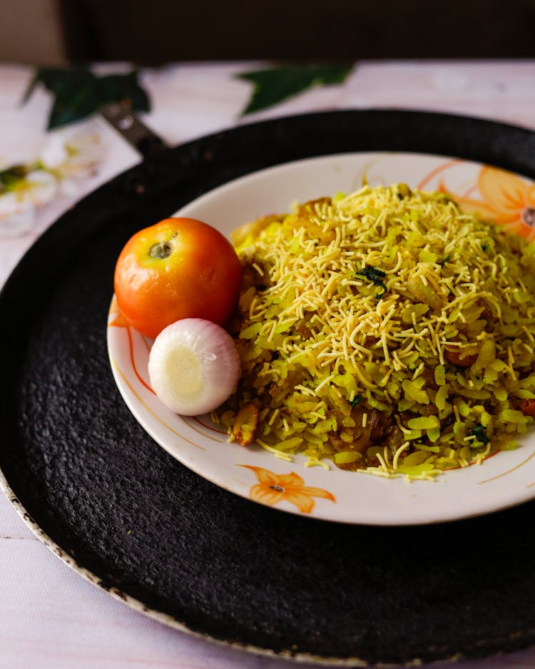 Indian Breakfast Dish Poha On White Wooden Background Photo