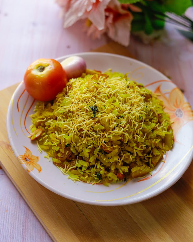 Indian Breakfast Dish Poha On White Wooden Background Photo