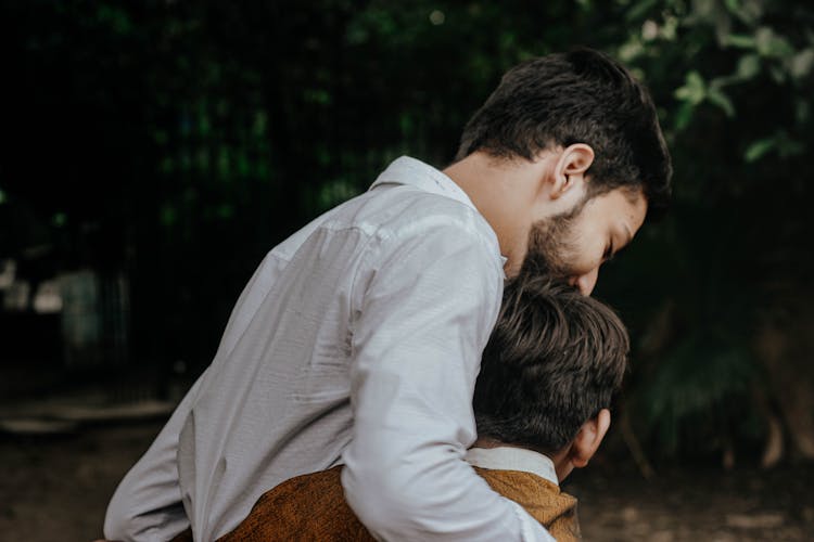 Father And Son Hugging Each Other