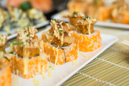 Close-up of gourmet sushi rolls with topping, perfect for food lovers.