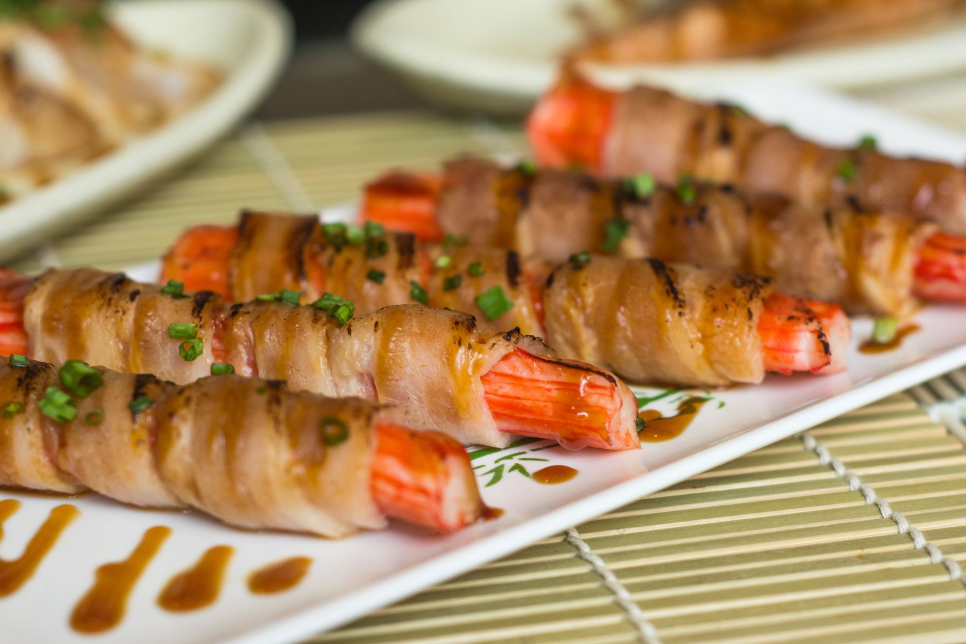 Closeup of candy bar and bacon baked rolls with flake salt and sugar