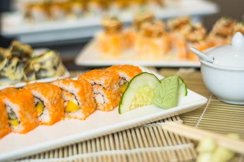 Sushi Rolls on White Ceramic Plate