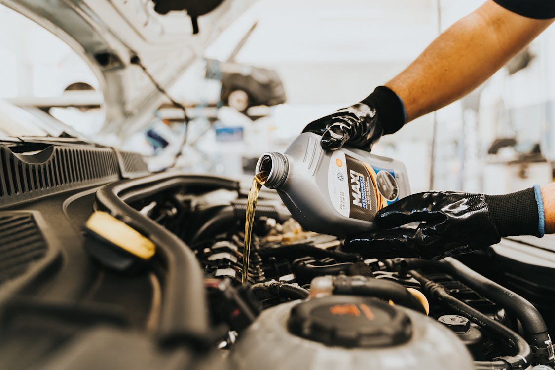 Free Pouring Oil to Engine Stock Photo