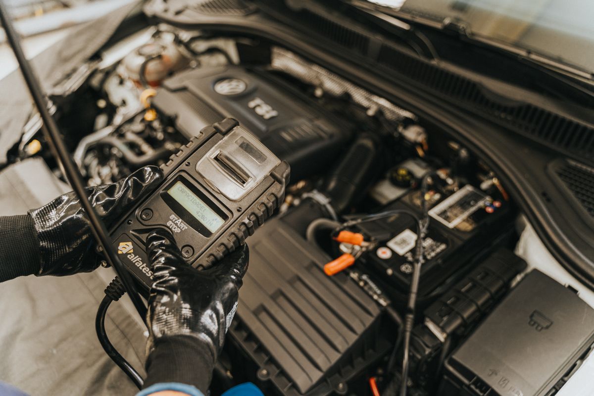 Pouring fresh oil into a truck engine