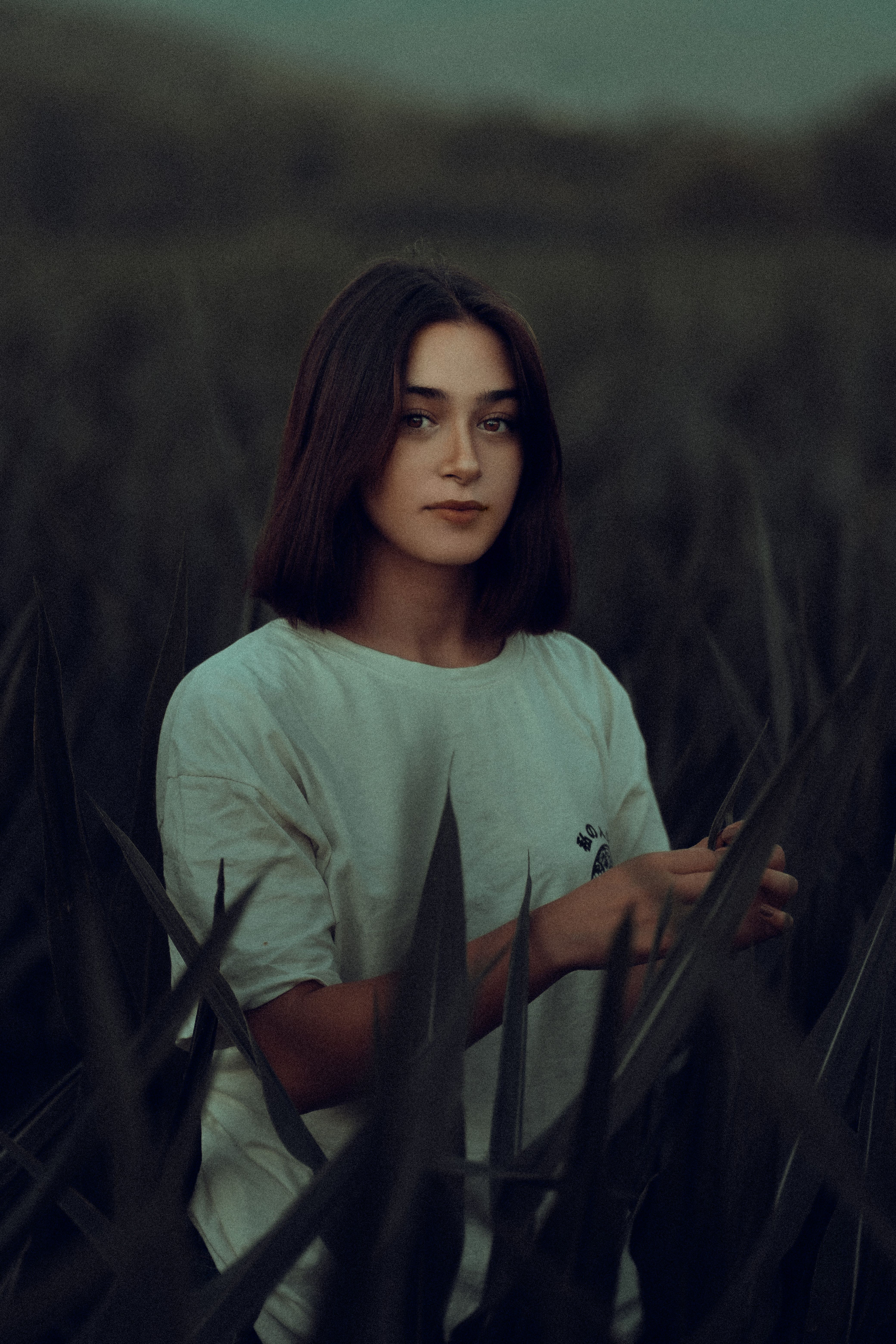 A Woman in White Shirt on Green Grass Field · Free Stock Photo