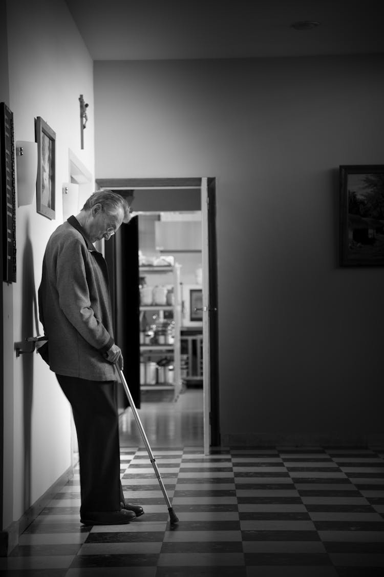 Man With Crutch Waiting