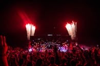People Gathering Near Stage With Fireworks