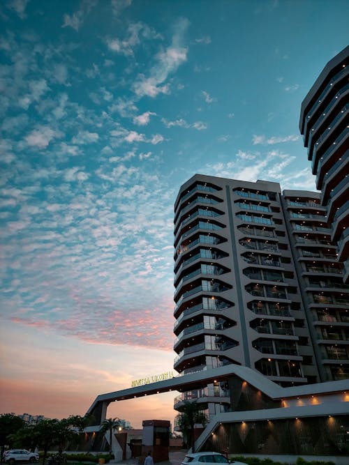 Low Angle Shot of Modern Apartment Buildings in City at Sunset 