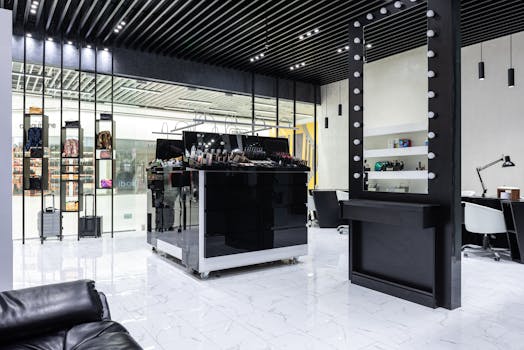 A sleek and modern salon with a central beauty product display and contemporary decor.