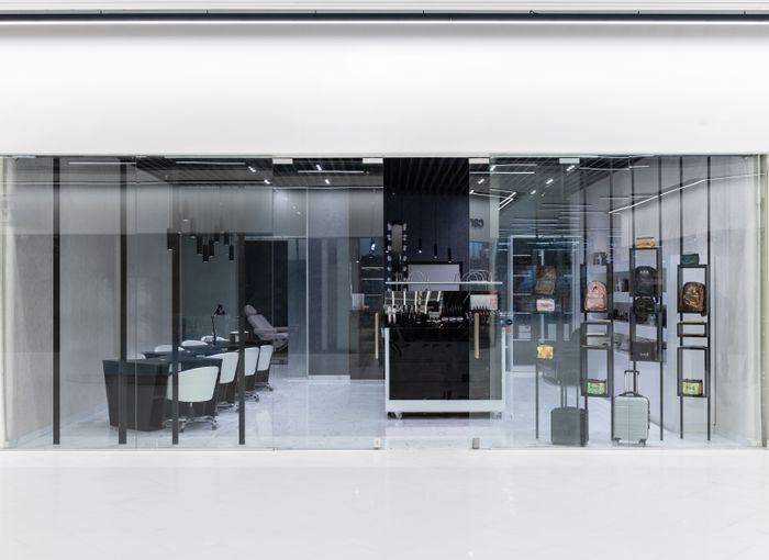 Bright modern retail storefront with glass facade similar to Harsha Electronics Mumbai