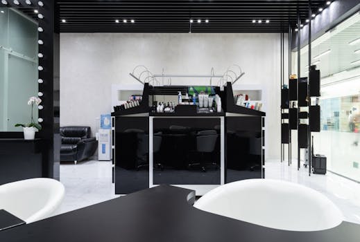 Chic modern beauty salon with black and white decor, offering a luxury experience.