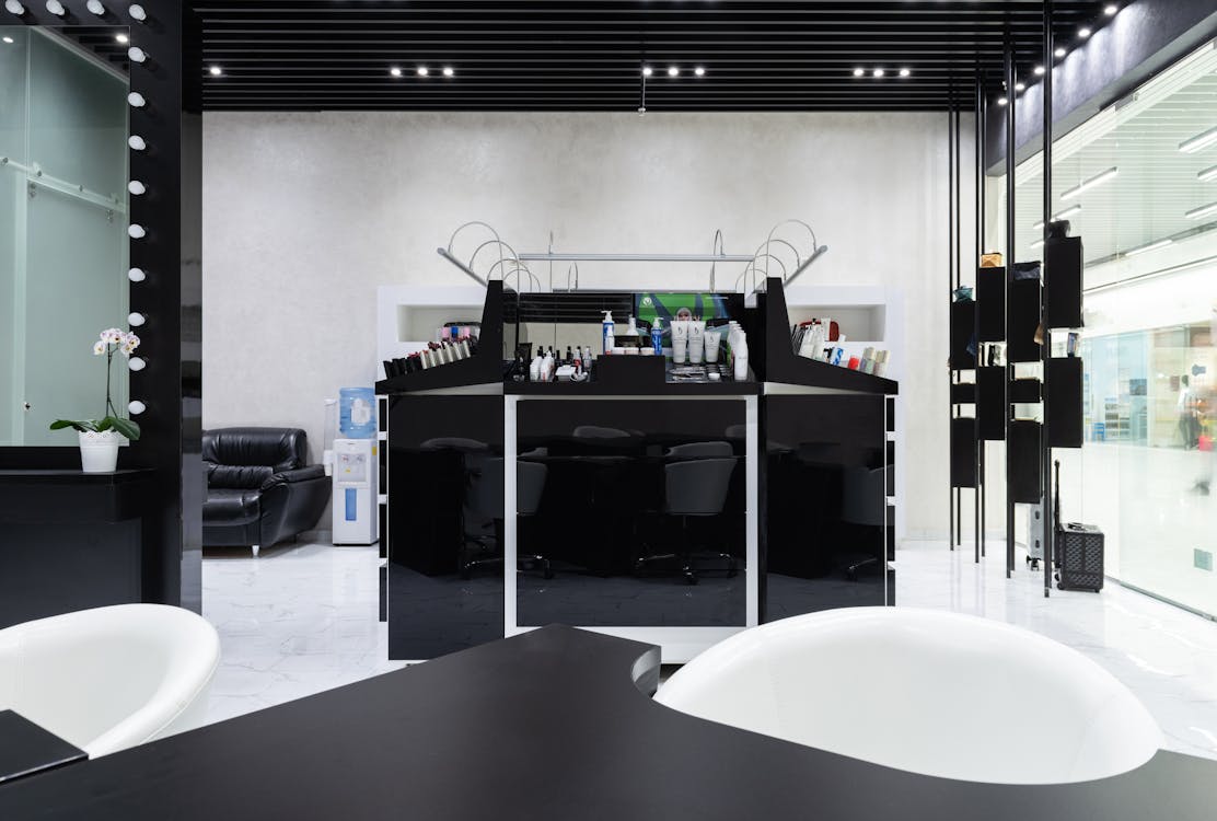 Black Shiny Cabinet with Cosmetics at Beauty Shop