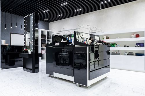 Free Modern cosmetic store with sleek display units and shelving, showcasing products in a stylish interior. Stock Photo