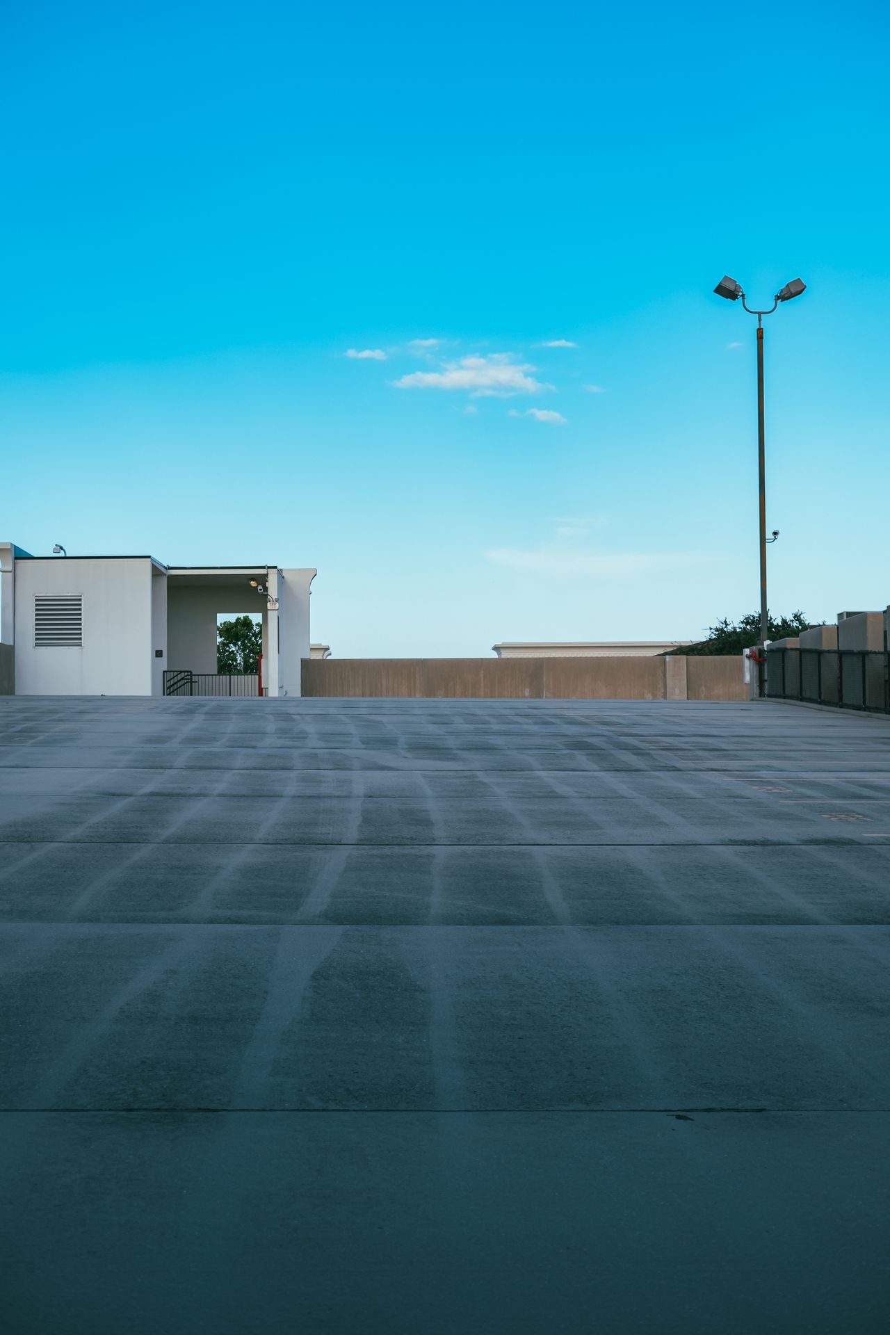 Large finished concrete driveway in front of a home