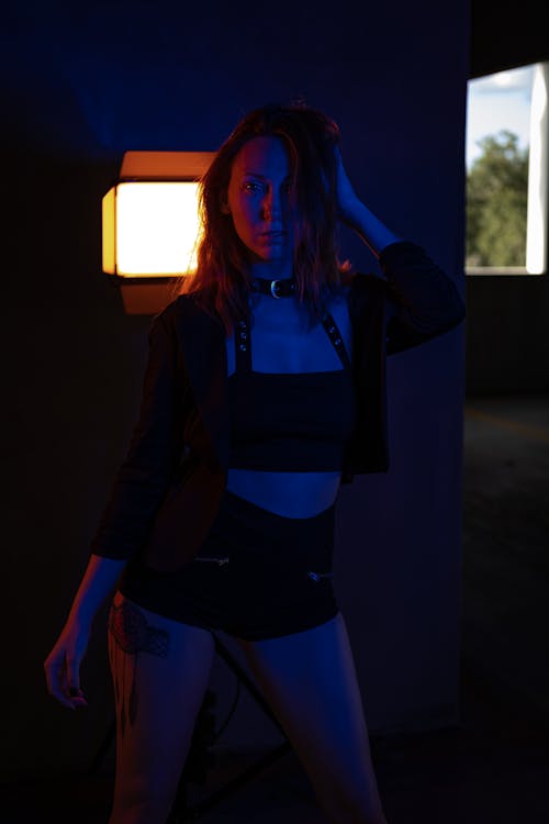 Sexy Woman Posing in Dark with Light