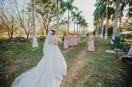 Bride Walking on Unpaved Pathway