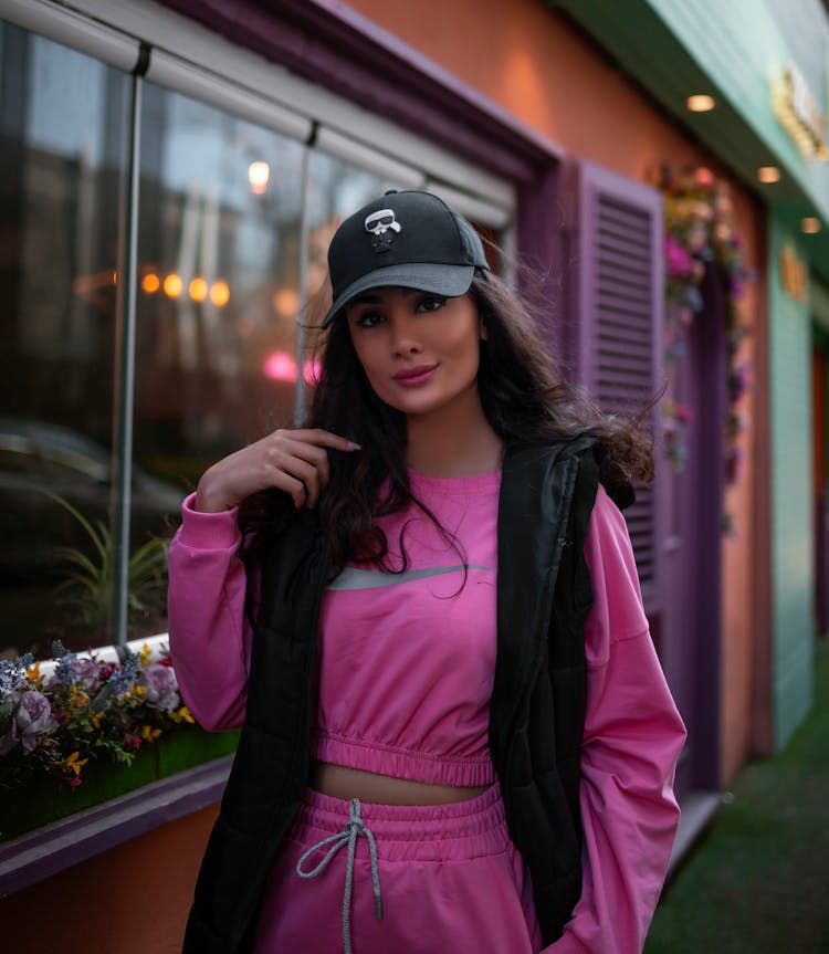 A Woman In Pink Athleisure Clothing